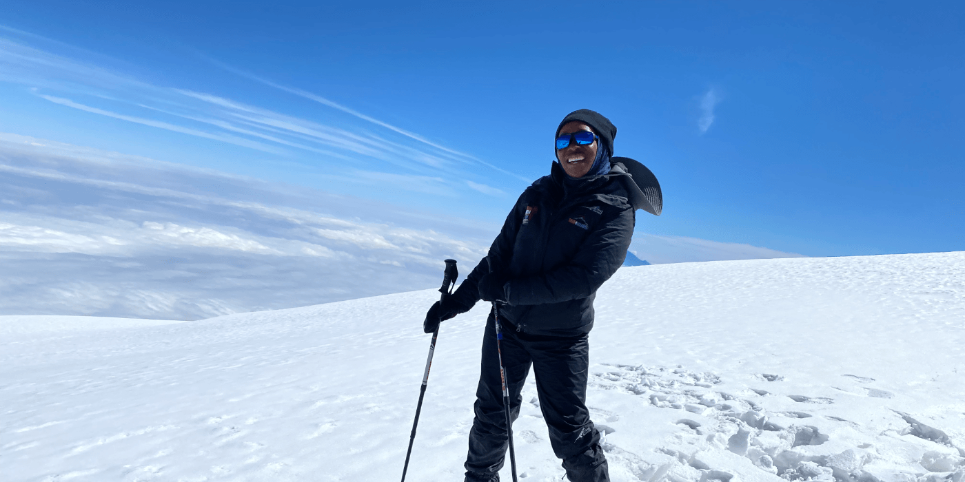 Smiling hiker wintry mountain